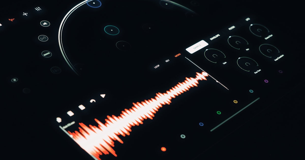 A close up of a remote control with a sound wave