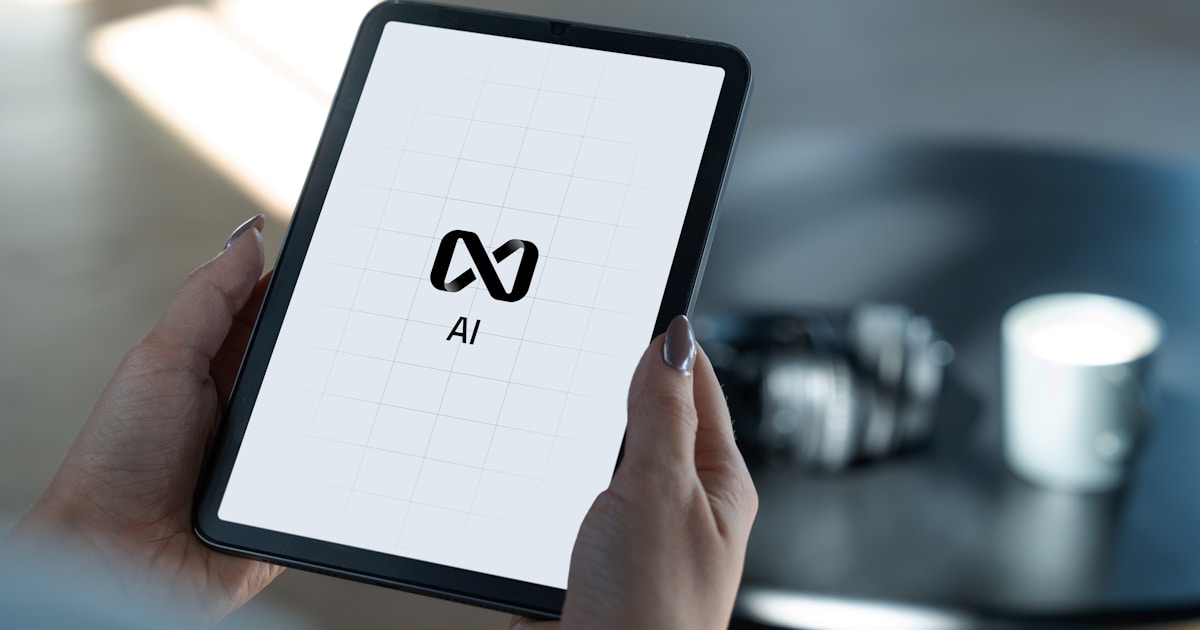 Hands holding a tablet displaying ai logo